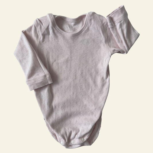 Uniqlo light pink onesie size 0